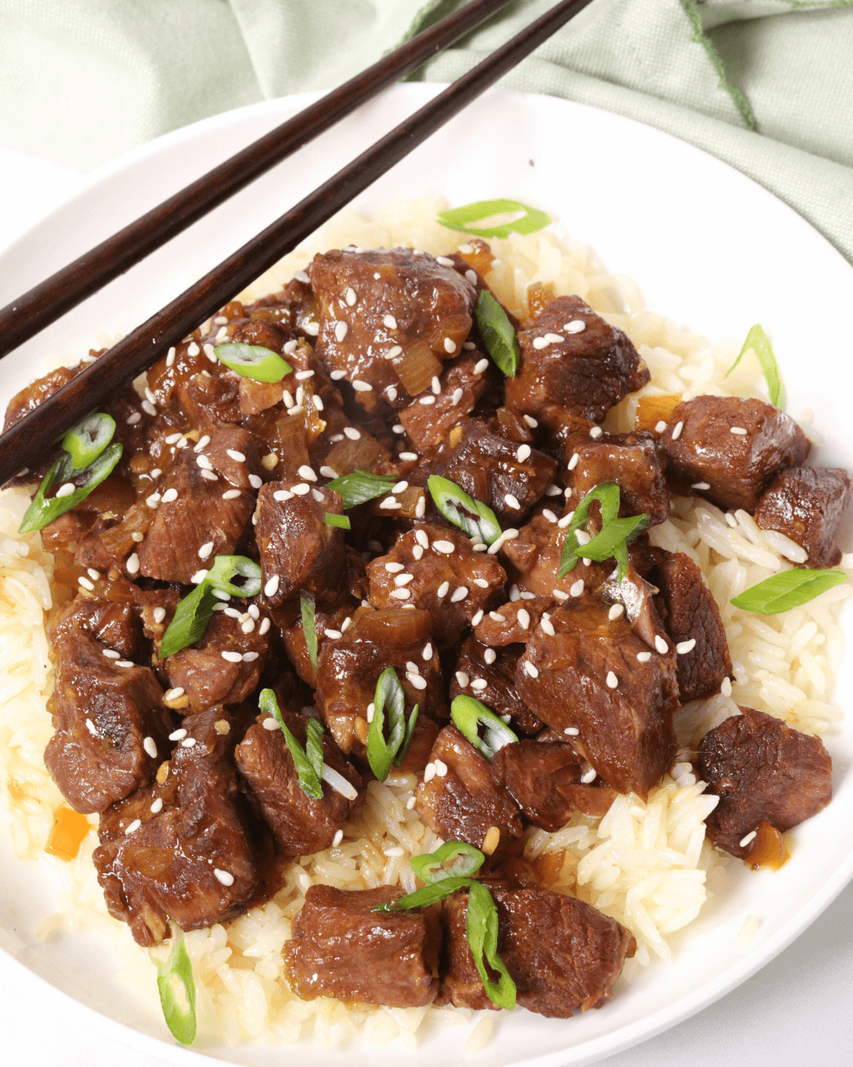 A white plate of slow cooker beef bulgogi bowl.