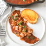 A finished serving of the steak pizzaiola along with the finished dish.