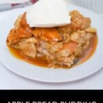 A slice of Bread Pudding with Bourbon Sauce is topped with vanilla ice cream and served on a white plate for the perfect decadent dessert.