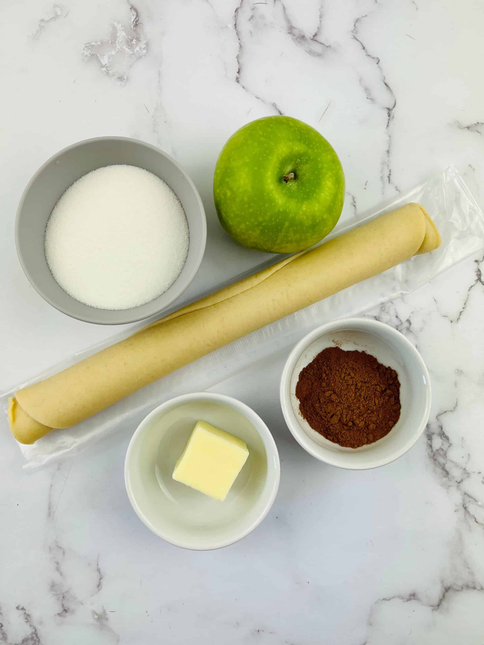 Puff pastry, apple, butter and sugar.