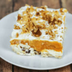 A side view of the pumpkin lush with nuts on top.
