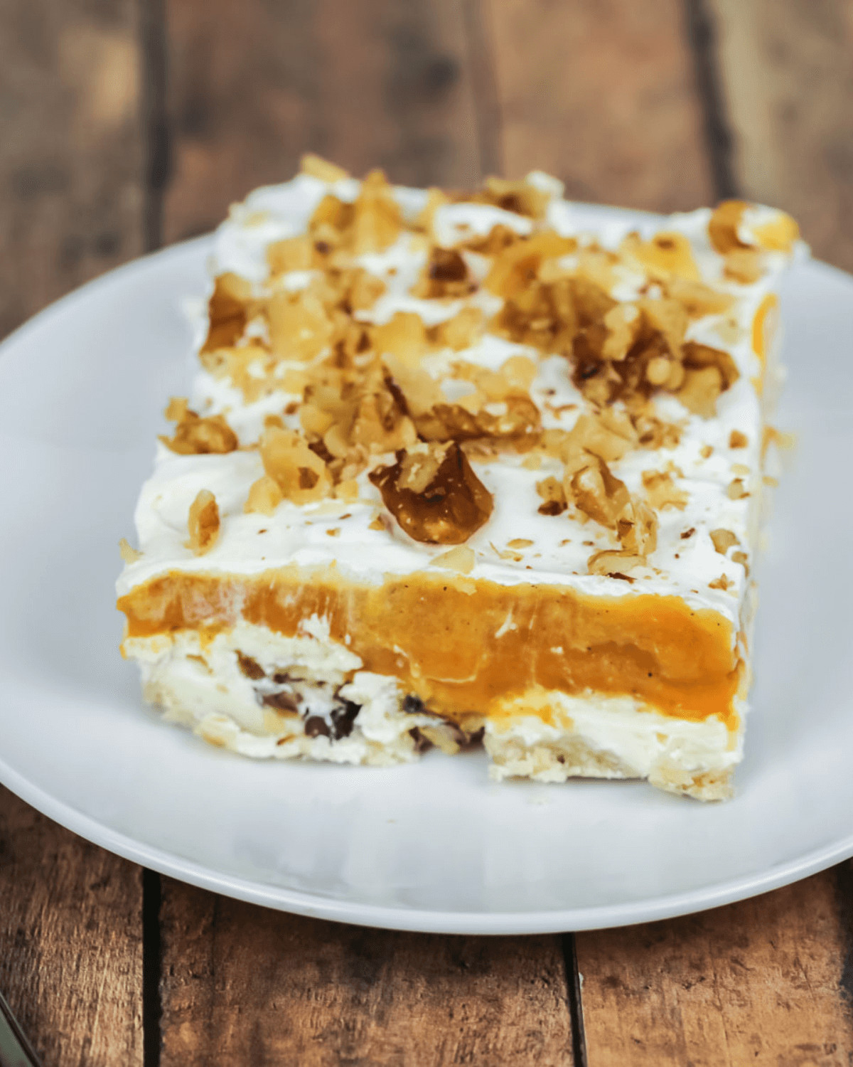 A side view of the pumpkin lush with nuts on top.