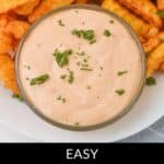 Crinkle-cut fries on a plate with a bowl of Sheetz Boom Boom Sauce topped with herbs. Text at the bottom reads "Easy Sheetz Boom Boom Sauce.