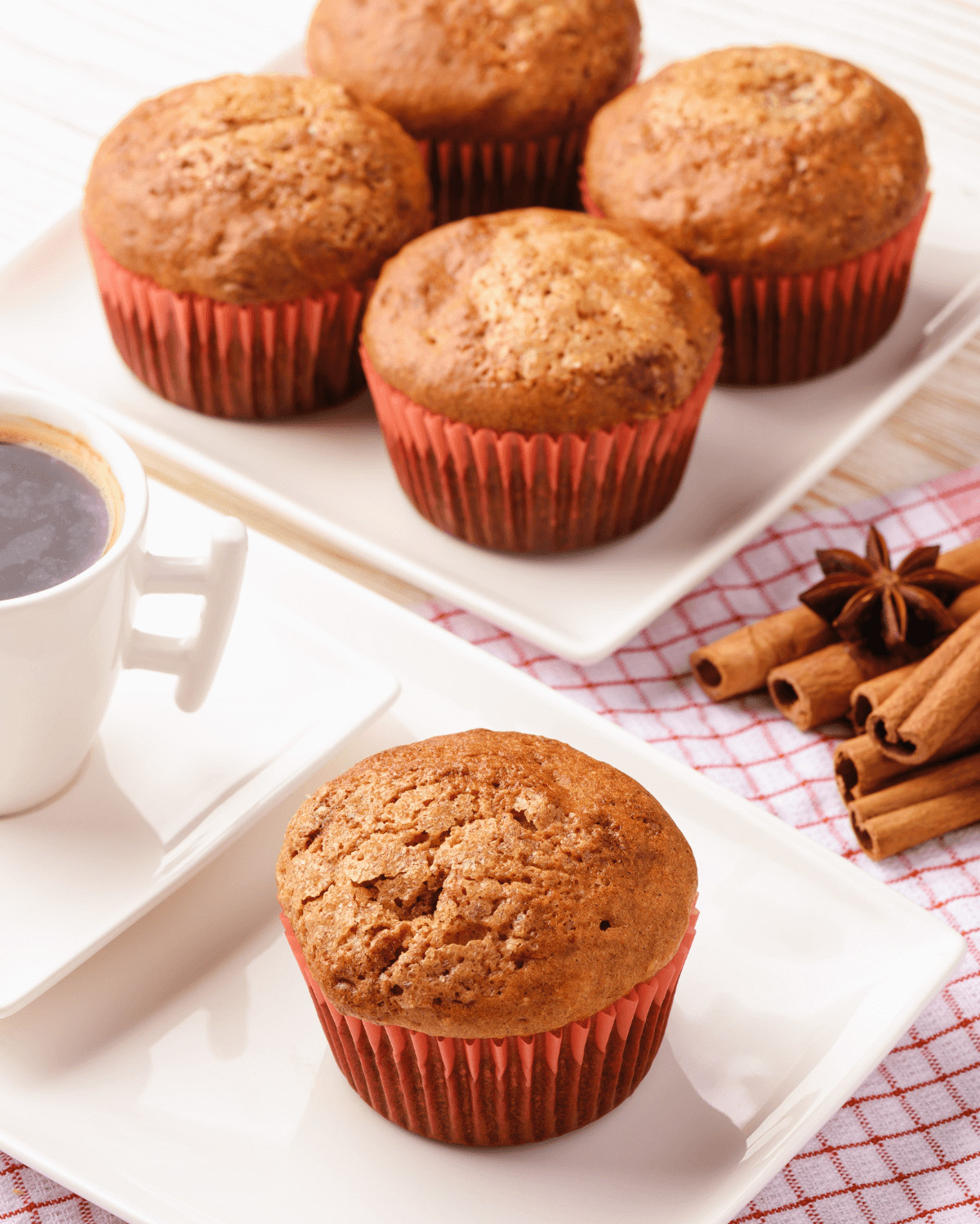 Spice cake pumpkin muffins with coffee on the side.