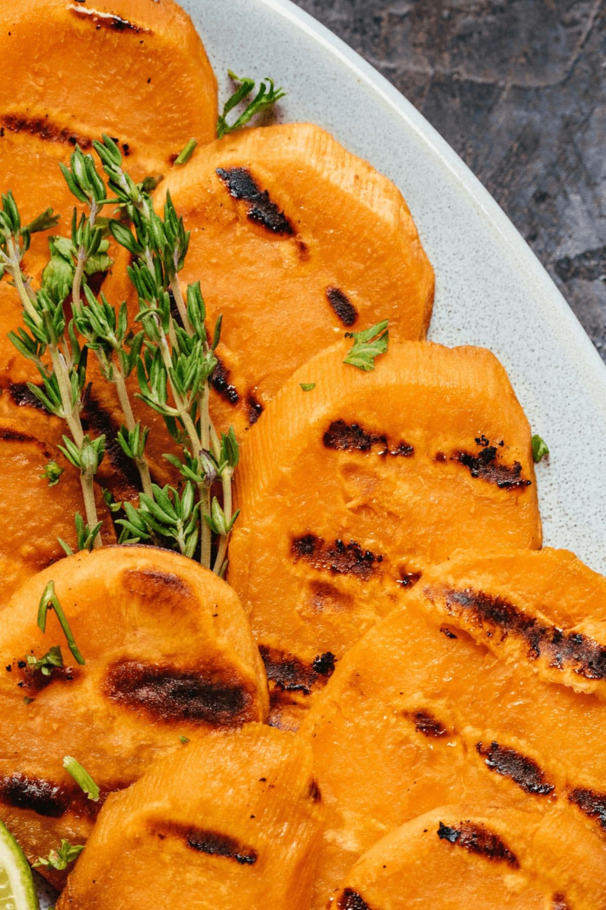 Sweet potato rounds with grill marks.