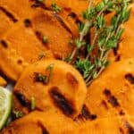 A top shot of the cooked rounds with thyme on top.