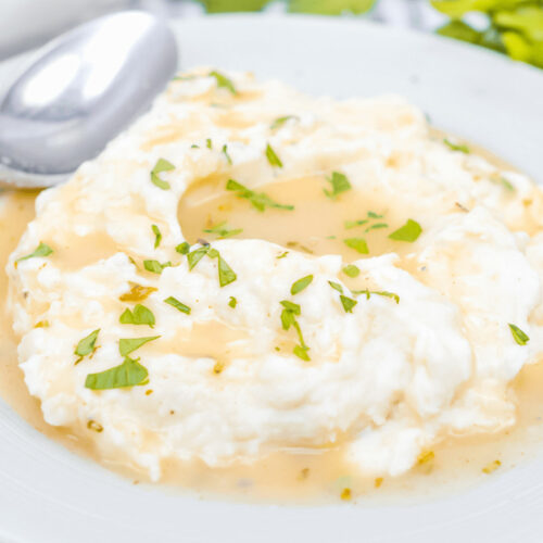 Mashed potatoes with turkey gravy without drippings on them.