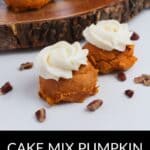 Four Cake Mix Pumpkin Spice Cookies with white frosting are arranged on a white surface and wooden tray, surrounded by pecan pieces. Text below reads "Cake Mix Pumpkin Spice Cookies.