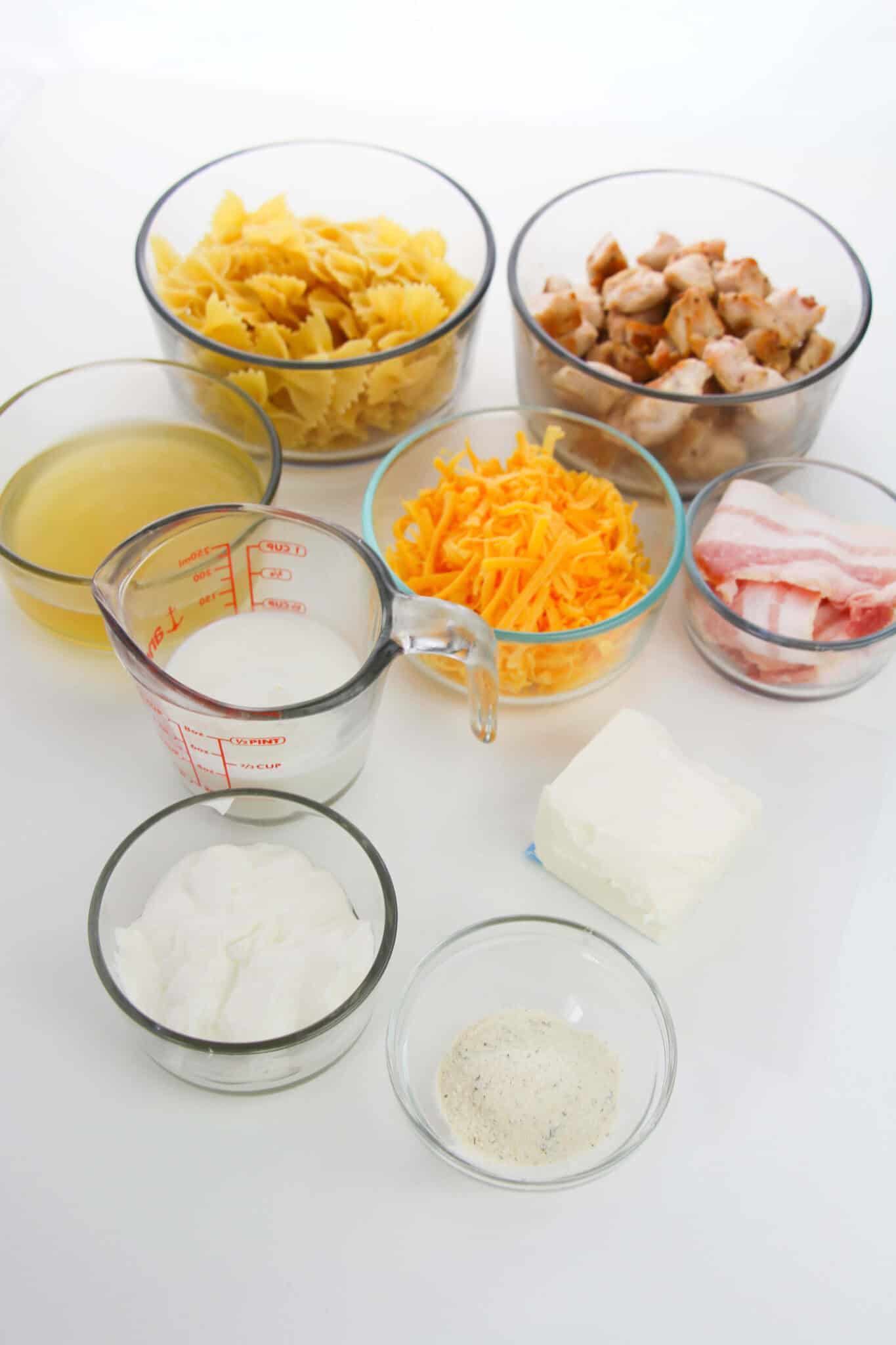 Cubed chicken, pasta and other ingredients.