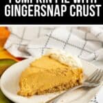 A slice of Cream Cheese Pumpkin Pie with gingersnap crust and a dollop of whipped cream on a white plate with a fork.