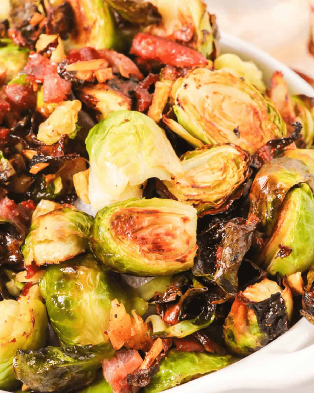 A closeup top shot of the crussel sprouts with prosciutto.