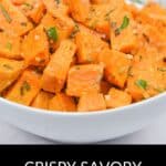 A white bowl filled with cubed, crispy roasted sweet potatoes garnished with herbs and spices. Text below reads: "Crispy Savory Sweet Potatoes." Try this easy savory sweet potatoes recipe for a delicious side dish.