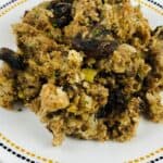 A serving on a white plate with a dotted border, placed on a patterned napkin.