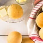 A basket of the side in a basket lined with a red and white towel.