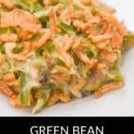 A serving of Green Bean Casserole without Mushroom Soup topped with crispy fried onions on a white plate, with the text "Green Bean Casserole Without Mushroom Soup" below.