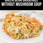 A serving of creamy Green Bean Casserole without Mushroom Soup, elegantly arranged on a white plate.