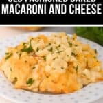 A plate of Old Fashioned Baked Macaroni and Cheese, garnished with chopped parsley, is served on a white polka-dotted plate for a comforting classic dish.