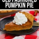 A slice of Old Fashioned Pumpkin Pie topped with whipped cream sits on a black plate, placed on a red and white checkered cloth.