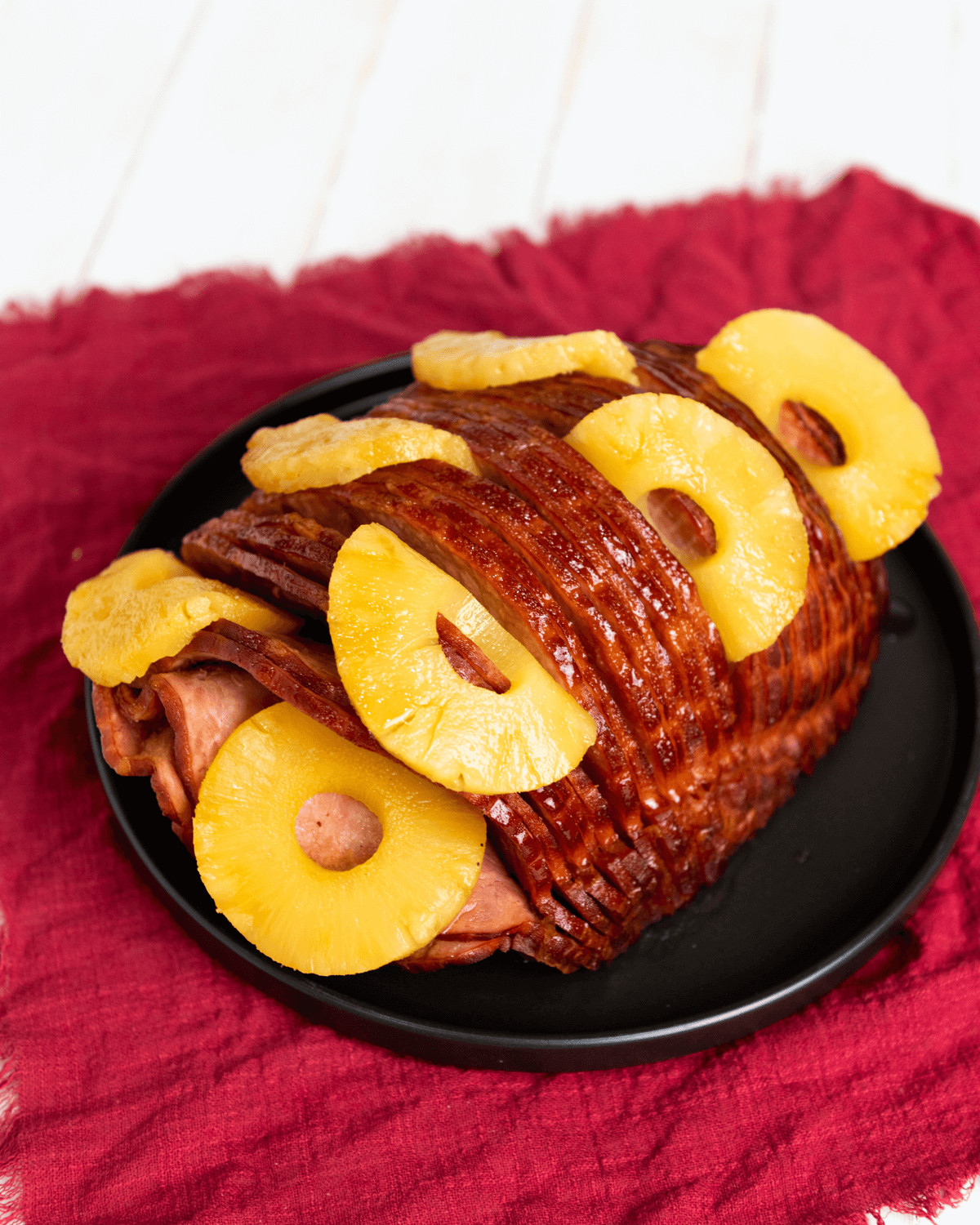 A whole ham decorated with pineapple and brown sugar.