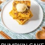 Two square slices of Pumpkin Crunch Cake topped with a scoop of vanilla ice cream, served on a white plate with pecans and cinnamon sticks nearby. Text reads "Pumpkin Cake Crunch.