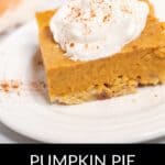 A square slice of Pumpkin Pie Dessert Bar topped with whipped cream and a sprinkle of cinnamon sits on a white plate.