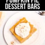 Pumpkin Pie Dessert Bars are topped with whipped cream and sprinkled with cinnamon, then served on a white plate with a fork nearby.