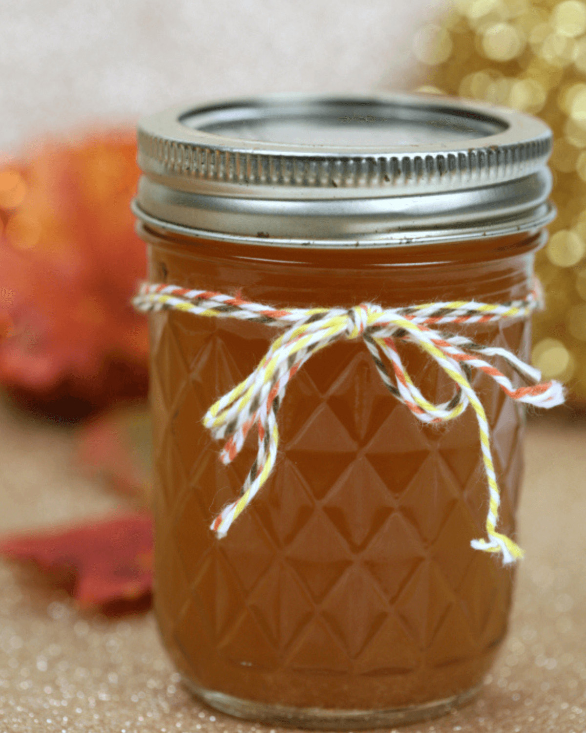 A mason jar of pumpkin moonshine.