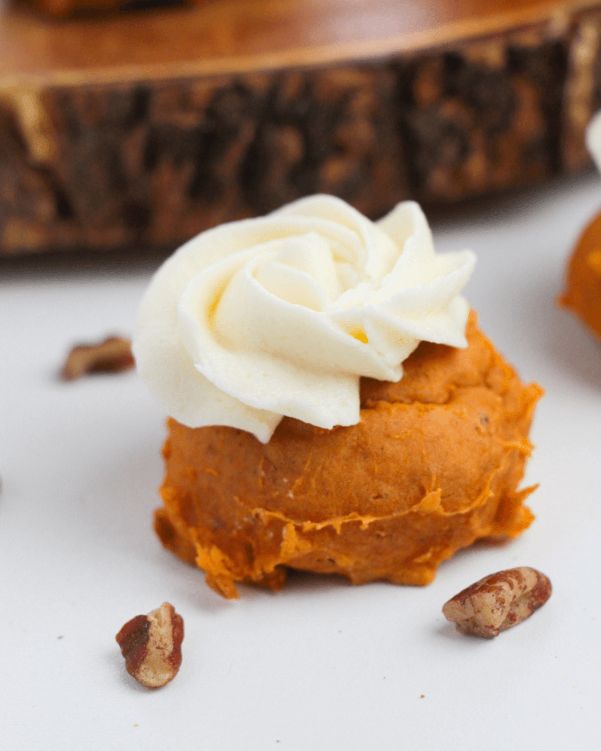 A tender pumpkin spice cake mix cookie with a cream icing.