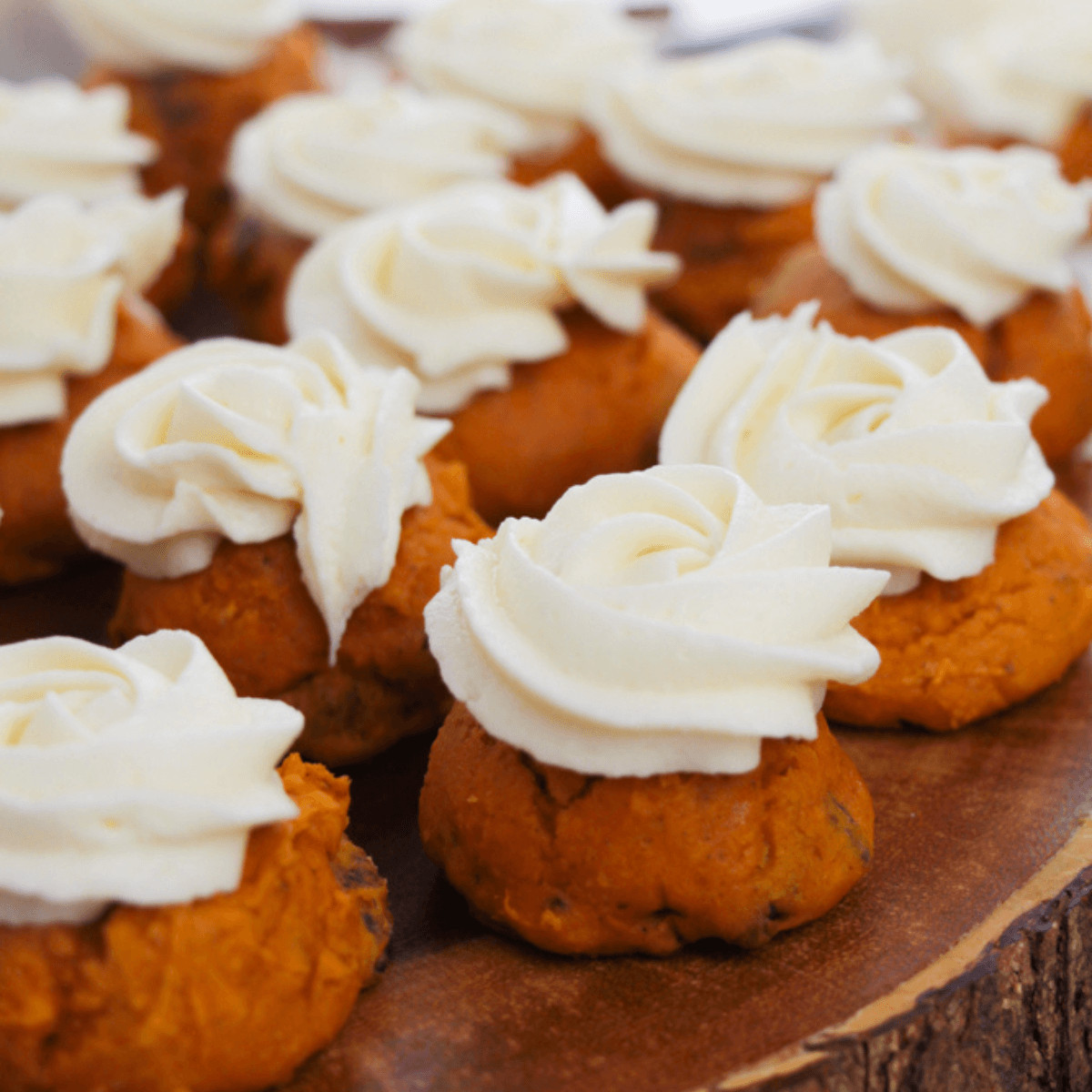 A side view of the pumpkin spice cookie with cream cheese frosting.