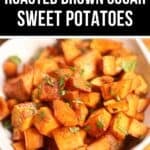 A white bowl filled with Brown Sugar Sweet Potatoes, roasted into tender cubes and garnished with chopped herbs.