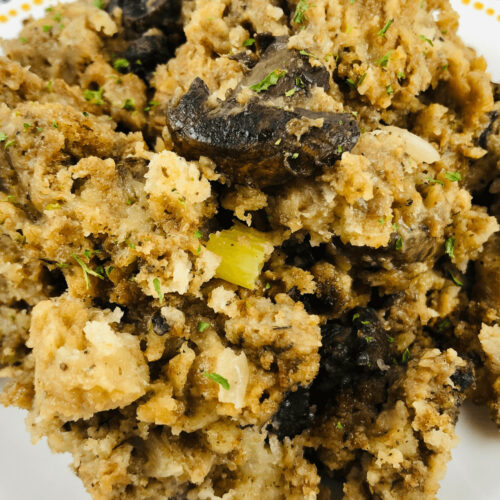 Slow cooker mushroom stuffing on a white plate.