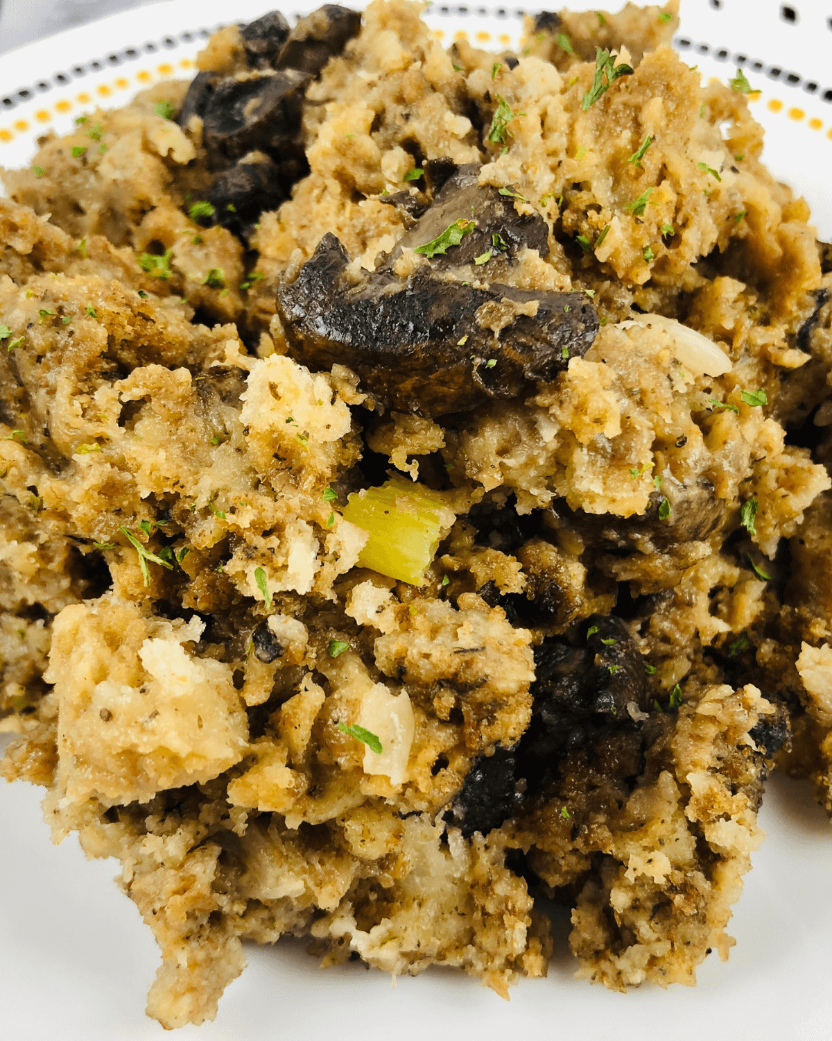 Slow cooker mushroom stuffing on a white plate.