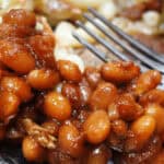 A dish of Southern Baked beans on a white dish.