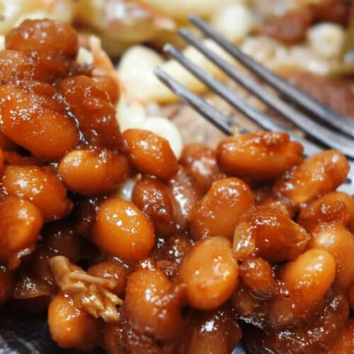 A dish of Southern Baked beans on a white dish.
