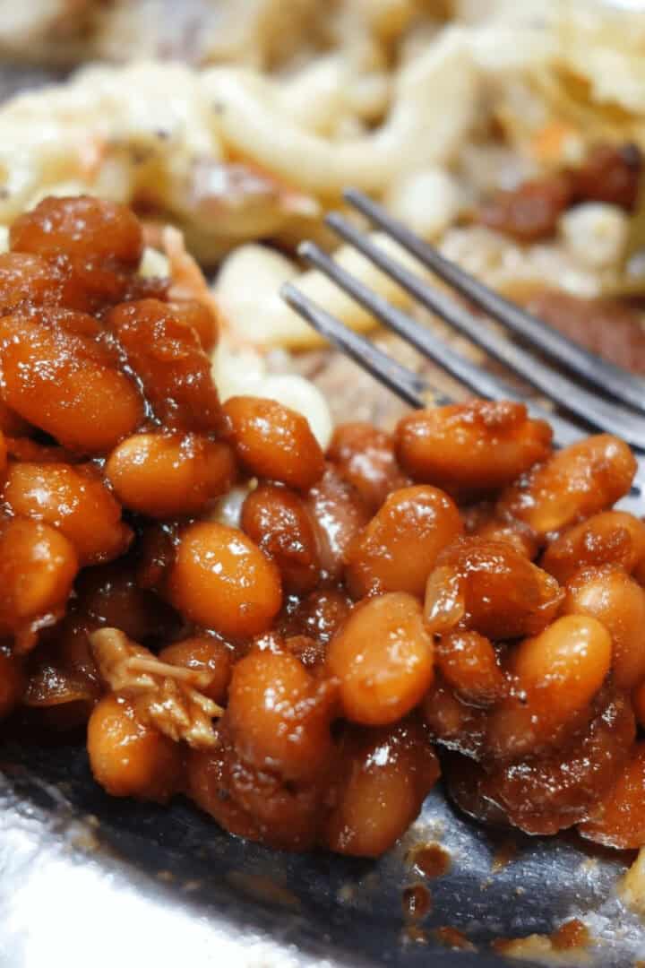 A dish of Southern Baked beans on a white dish.