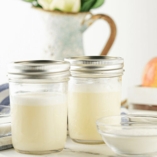 A mason jar of sweetened condensed milk.