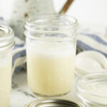 An open jar of the sweetened condensed milk.