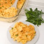 A plate and a baking dish of the velveeta mac & Cheese.