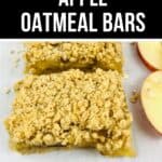 Two apple oatmeal bars with a crumbly topping rest on parchment paper next to fresh apple slices. Text above the bars reads "Soft Apple Oatmeal Bars.