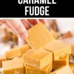 A hand picks up a square of rich Caramel Fudge from a plate stacked with multiple pieces of creamy caramel fudge.