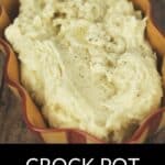 A serving dish filled with Crock Pot Mashed Potatoes topped with black pepper, with the text "Crock Pot Mashed Potatoes" displayed below the image.