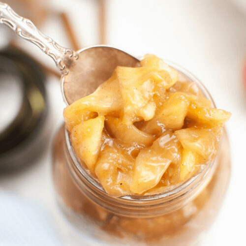 A canning jar of apple pie filing.