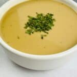 A white bowl filled with creamy ssauce.
