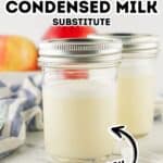 Two glass jars filled with a creamy white liquid labeled “Sweetened Condensed Milk Substitute,” with fresh fruit and a striped cloth in the background, showcase a delicious and versatile alternative to traditional sweetened condensed milk.