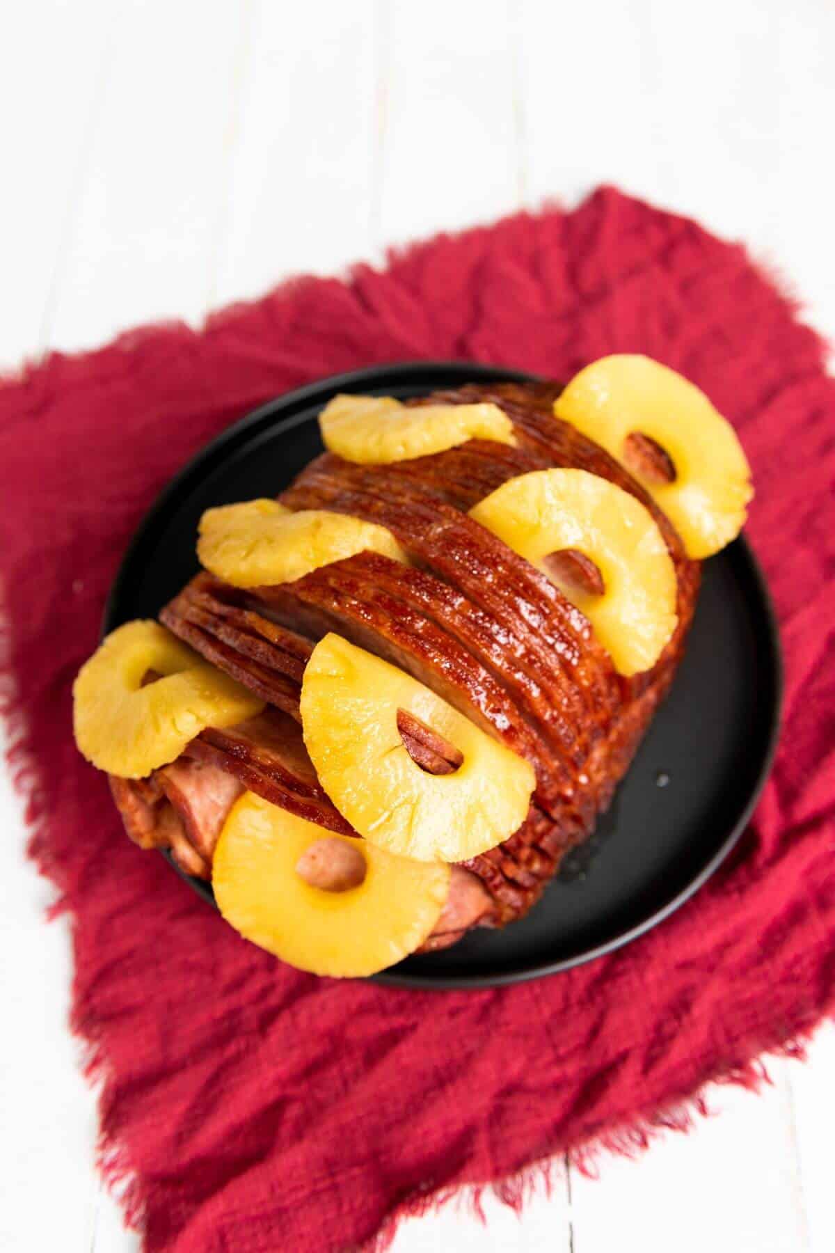 A whole ham with pineapple and brown sugar.