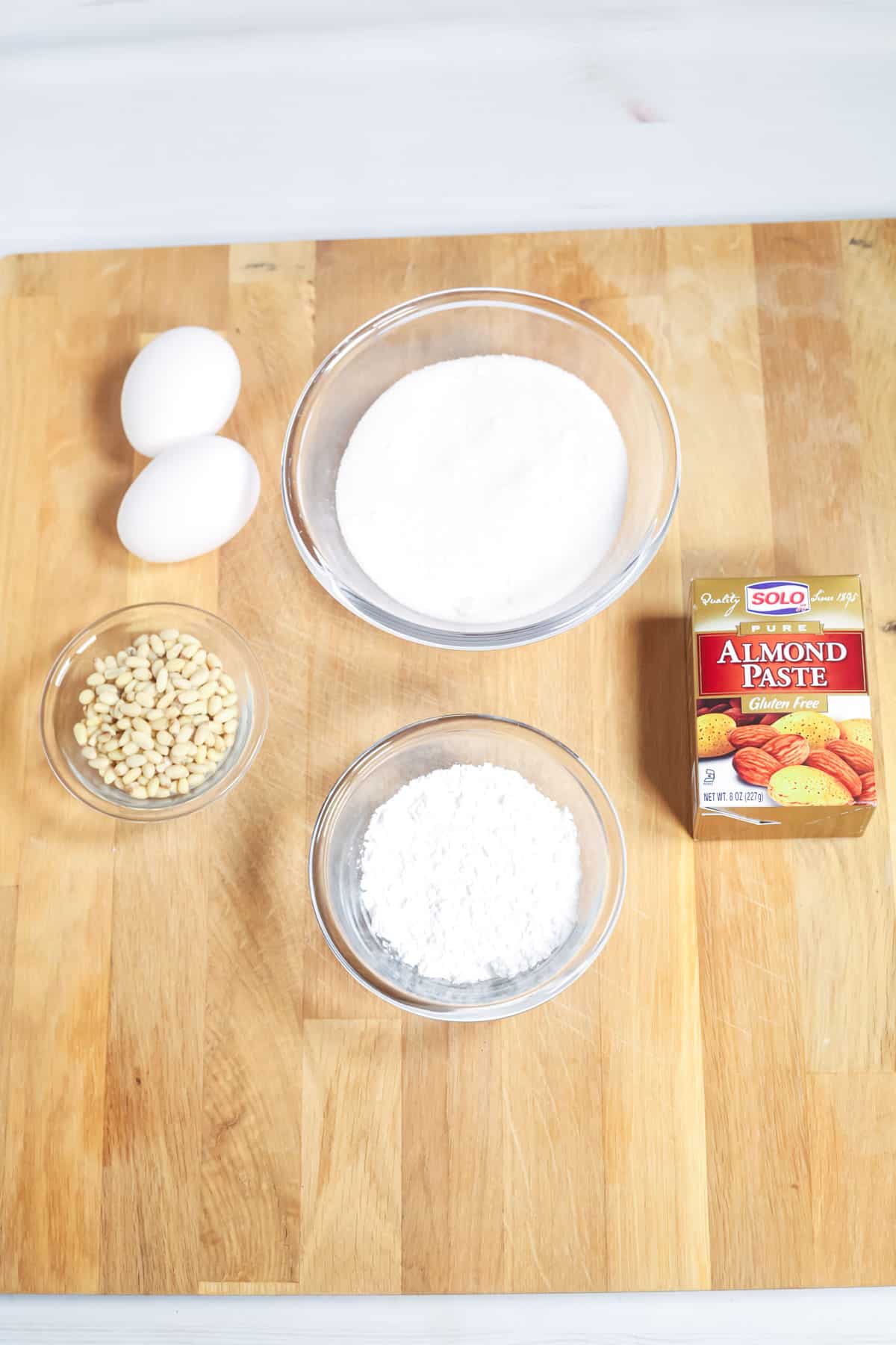 The nuts, flour sugar and eggs for the pine nut cookies.