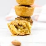 Three stacked, with a fourth in front that is cut open to reveal the rich, gooey filling.