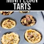 A muffin tin filled with baked Pecan Tarts in several cups and chopped pecans in one cup. Text above reads “Buttery Mini Pecan Tarts.”.