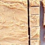 Candy partially sliced into rectangular pieces on a sheet of parchment paper.