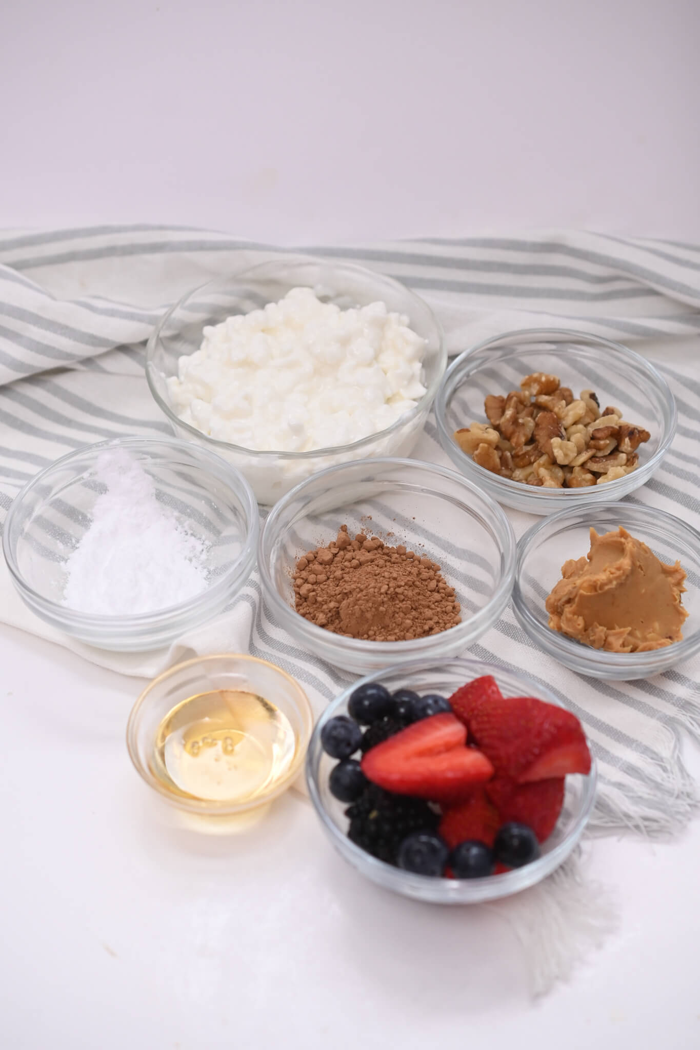 Cottage cheese, fruit, chocolate and ingredients for the bowl.